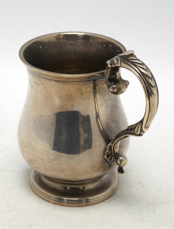 A William IV silver baluster christening mug, maker's mark rubbed, London, 1832, 11.8cm, 7.5oz, with later engraved inscription. Condition - poor